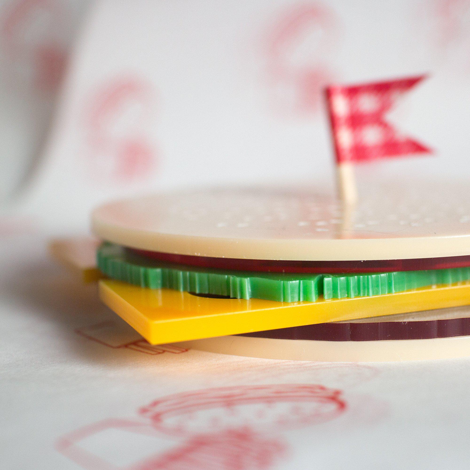 Side profile of burger coasters made by finest imaginary